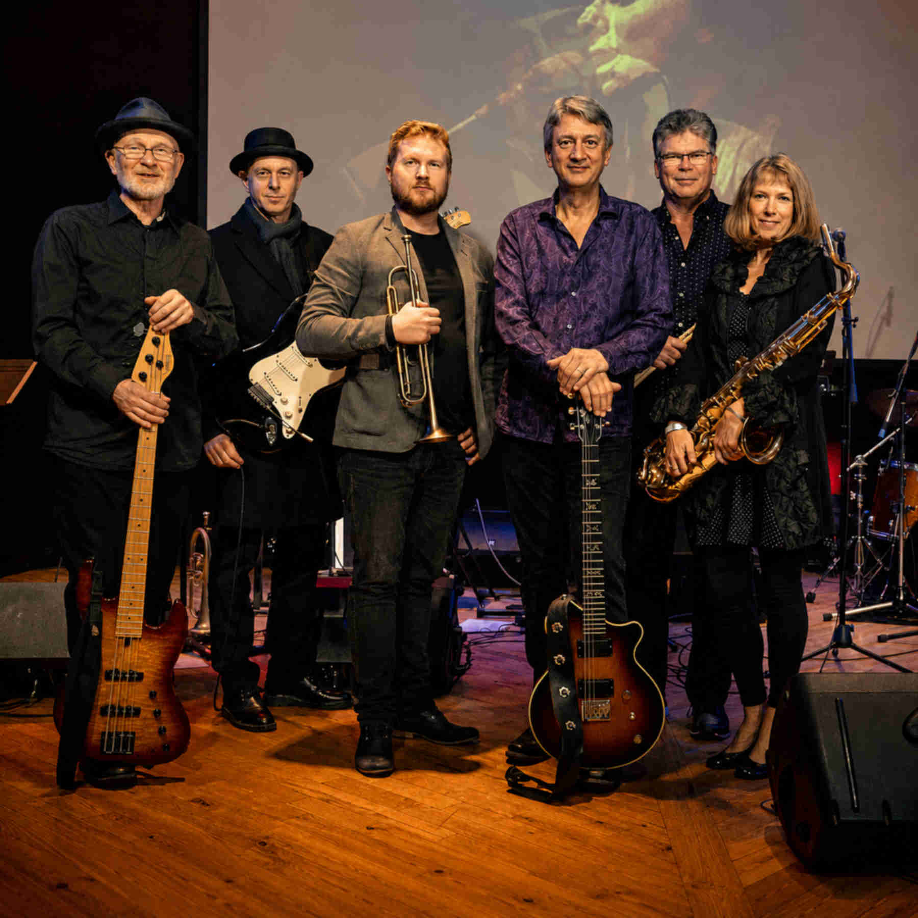 The Vancouver, BC, Canada band Moondance, which plays the Van Morrison Songbook, posing among their instruments.